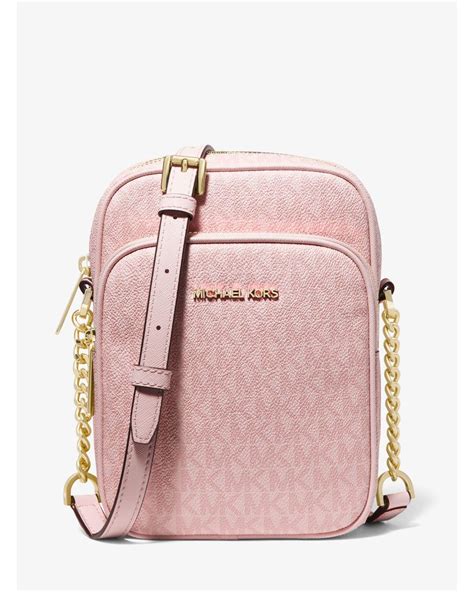 michael kors jet set travel crossbody bag pale pink|Michael Kors bag with airplanes.